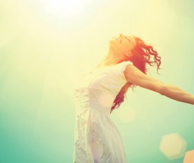 woman stretching her arms in the sun Stock Photo