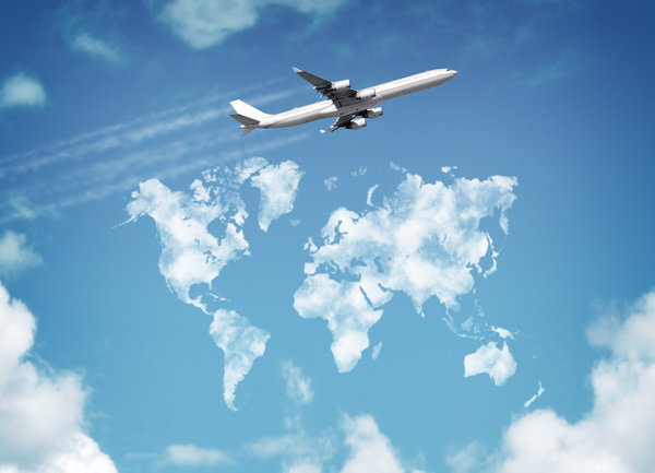 A passenger plane flying under the blue sky Stock Photo