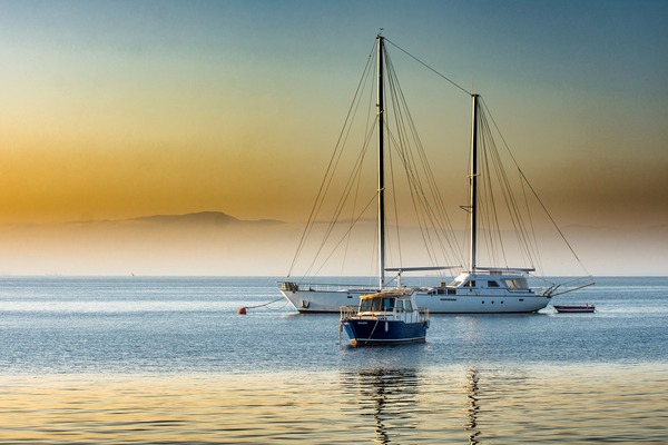 A yacht parked in the bay Stock Photo