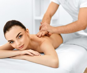 Beautician for the customer body care Stock Photo