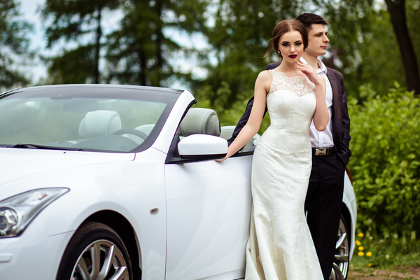 Beautiful bride and groom near the wedding car Stock Photo 01