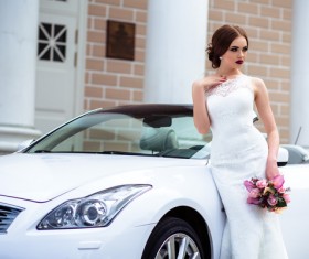 Beautiful bride near the wedding car Stock Photo 01