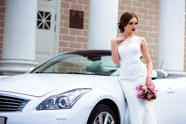 Beautiful bride near the wedding car Stock Photo 01