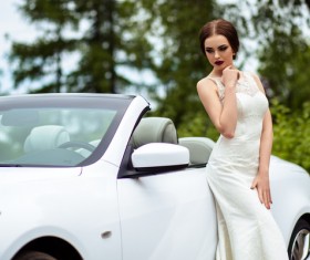 Beautiful bride near the wedding car Stock Photo 02
