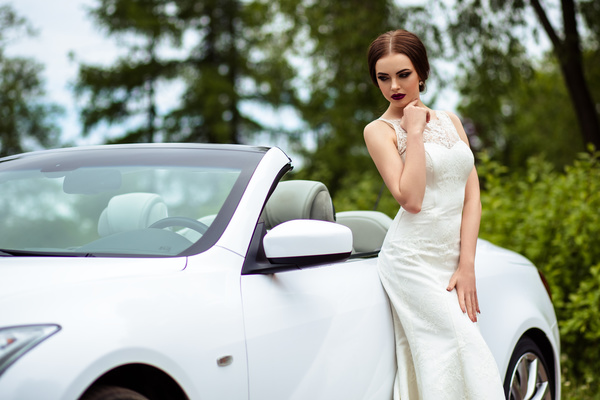 Beautiful bride near the wedding car Stock Photo 02