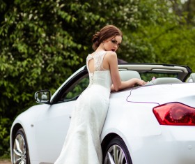 Beautiful bride near the wedding car Stock Photo 03