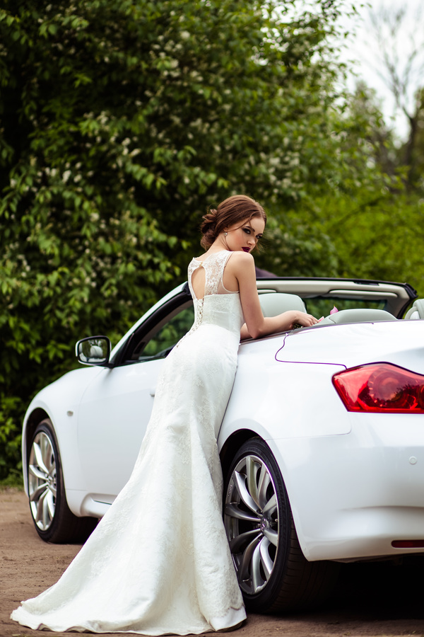 Beautiful bride near the wedding car Stock Photo 03