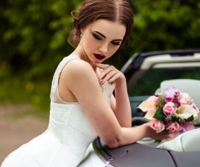 Beautiful bride near the wedding car Stock Photo 04