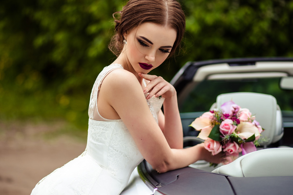 Beautiful bride near the wedding car Stock Photo 04