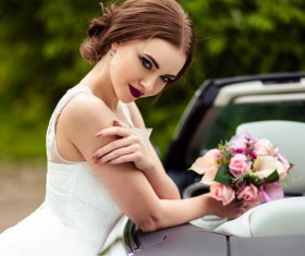Beautiful bride near the wedding car Stock Photo 05