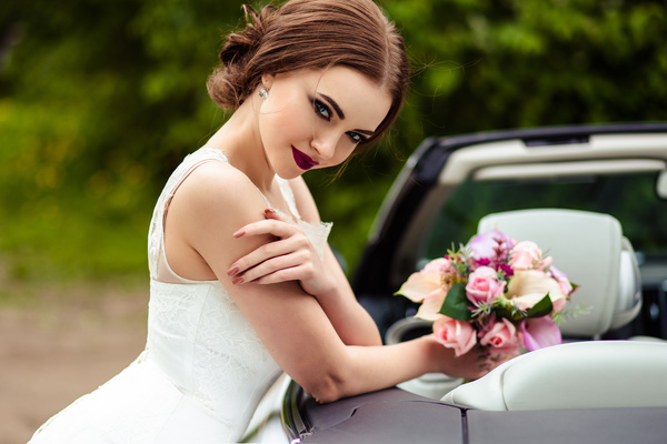 Beautiful bride near the wedding car Stock Photo 05