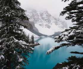 Beautiful calm lake on snowy mountain Stock Photo