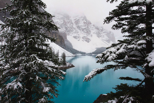 Beautiful calm lake on snowy mountain Stock Photo