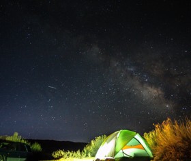 Camping outdoor under bright starry sky Stock Photo