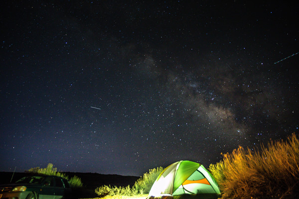 Camping outdoor under bright starry sky Stock Photo