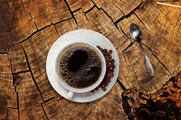 Coffee on a wooden cracked table Stock Photo