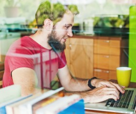 Coffee on the desktop with people using the computer Stock Photo 01