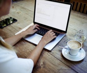 Coffee on the desktop with people using the computer Stock Photo 04