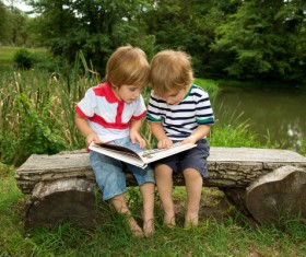 Comic books together to see two children Stock Photo