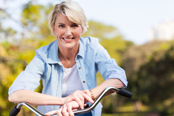 Cycling middle-aged women Stock Photo