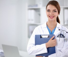 Female doctor holding medical records Stock Photo