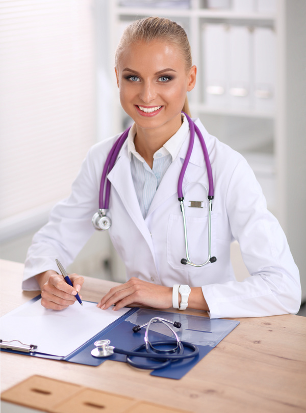Female doctor write disease cure Stock Photo 01