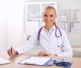 Female doctor write disease cure Stock Photo 02