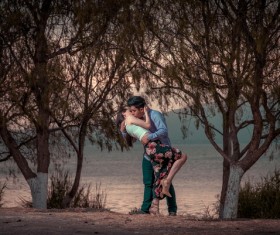 Hug kissing couple Stock Photo