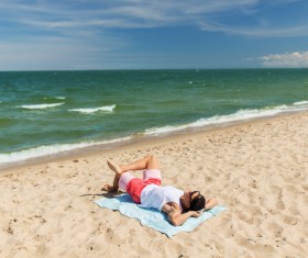 Man lying on the beach Stock Photo