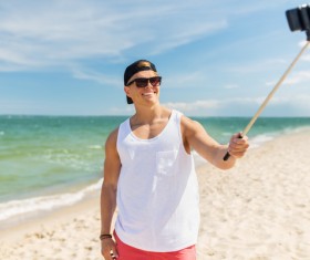 Man with smart phone self-timer Stock Photo 02