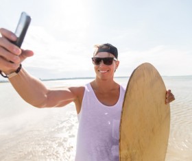 Man with smart phone self-timer Stock Photo 03