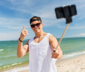 Man with smart phone self-timer Stock Photo 04