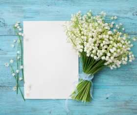On the desktop bluebells and blank paper Stock Photo