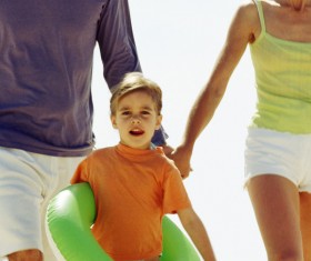 Parents of children with hold swimming ring Stock Photo