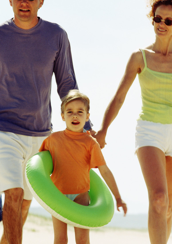 Parents of children with hold swimming ring Stock Photo