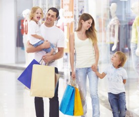 Parents with children shopping Stock Photo