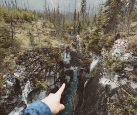 Person in front of beautiful wild mountain landscape Stock Photo