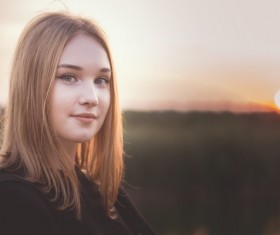 Rising Sun and girl Stock Photo