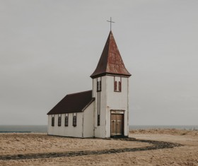 Simple church on seaside scene Stock Photo