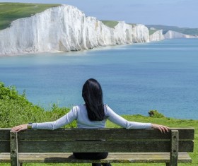 Sitting in a chair to rest on the woman looking at the distant scenery Stock Photo