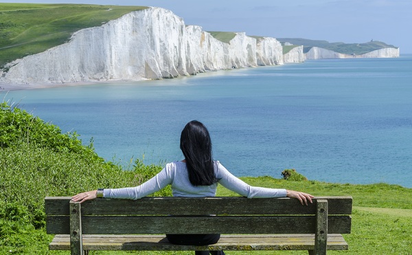 Sitting in a chair to rest on the woman looking at the distant scenery Stock Photo
