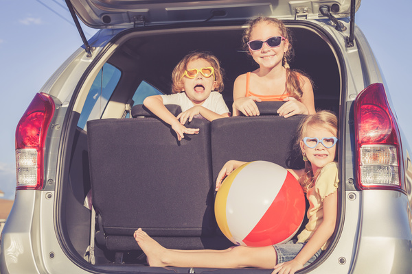 Sitting in the car trunk in children Stock Photo