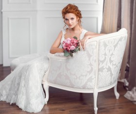 Sitting on the chair of the beautiful bride Stock Photo