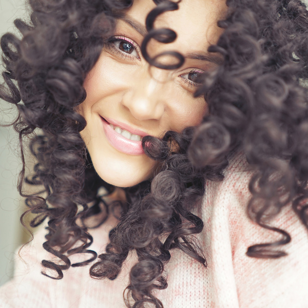 Smiling black curly woman Stock Photo 02