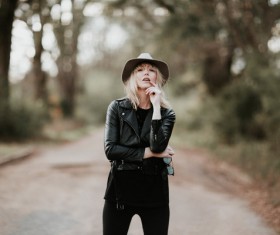 Stylish woman posing with leather coat Stock Photo