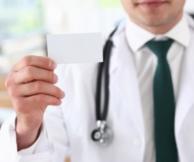 Take a business card doctor Stock Photo