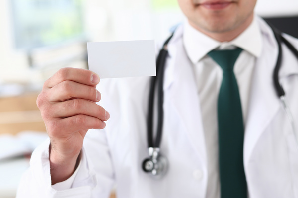 Take a business card doctor Stock Photo