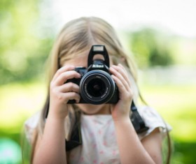 Take pictures of the little girl Stock Photo