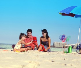 The beach watching her daughter to play the happy couple Stock Photo