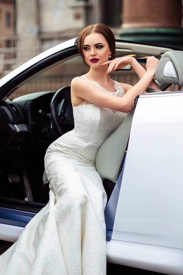 The beautiful bride sitting in a wedding car Stock Photo 04